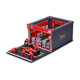 Modell Bburago Scuderia Ferrari F1 1:43 Charles Leclerc mit Boxenmodell